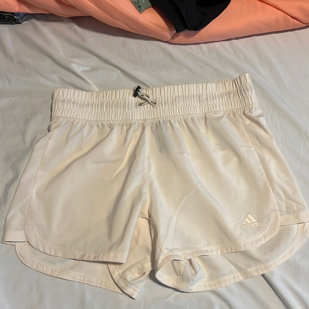 Crème colored Adidas athletic shorts